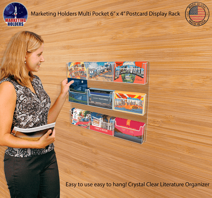 Six inch wide Post Card Display System Nine Pocket Wall Mount with literature on a wooden wall with a model and text