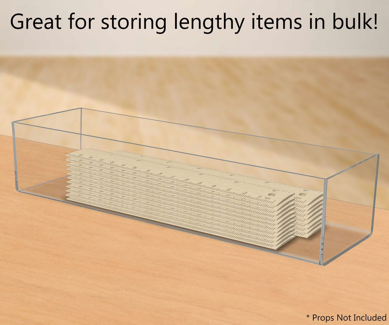 Fifteen Inches Wide by Three and Three Quarters Inches High Clear Compartment Bin With Rules on Countertop