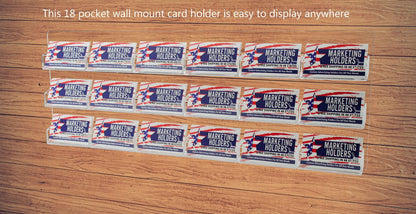 Eighteen Pocket Wall Business Card Rack Holder Horizontal Hanging filled with business cards on a wall