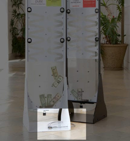 Lock and cable on donation stand