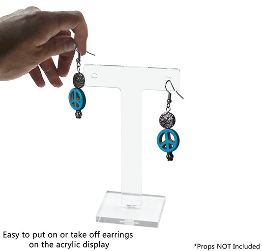 Ear bar small earring holder with earrings and verbiage text with a hand in action shot