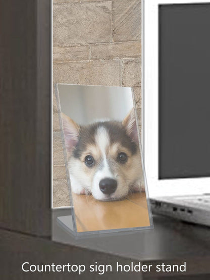 Four Inch by Six Inch High Top Load Sign Holder TRU-VU® Slant Back Medical Stores on a table top with a photo