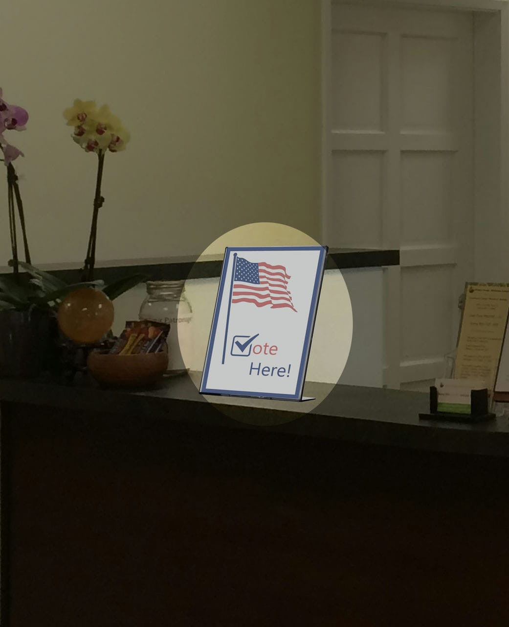 Sign Holder TRU-VU® Table Tent Top Load Wide Base in an office environment on a desk