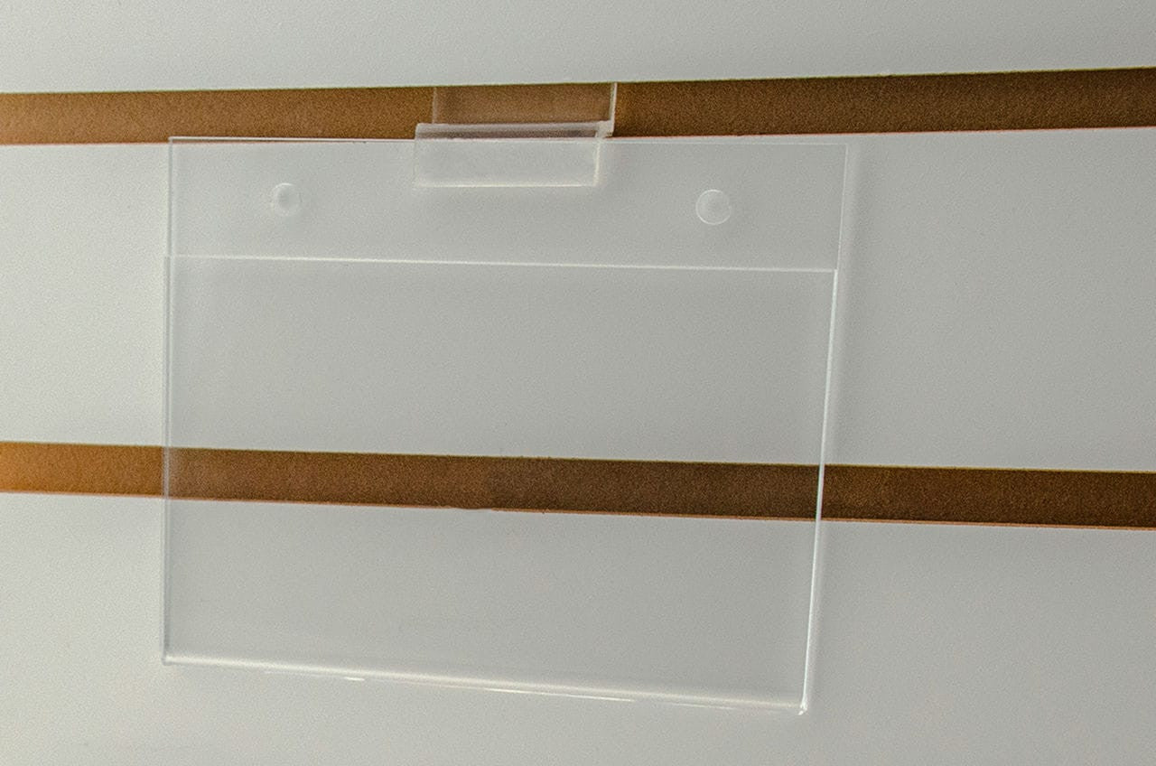 Sign Holder on Slatwall Five and a Half Inches Wide by Three and a Half Inches High