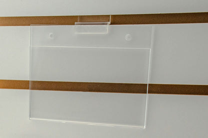 Sign Holder on Slatwall Five and a Half Inches Wide by Three and a Half Inches High